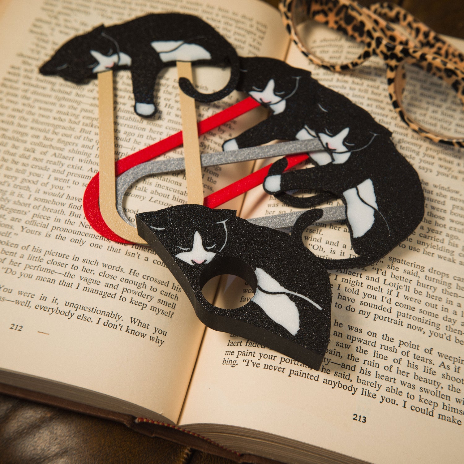 Matching black and white tuxedo cat bookmarks and page holder