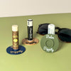 Three color combinations of the vinyl record lip balm holders including olive, beige, and navy blue
