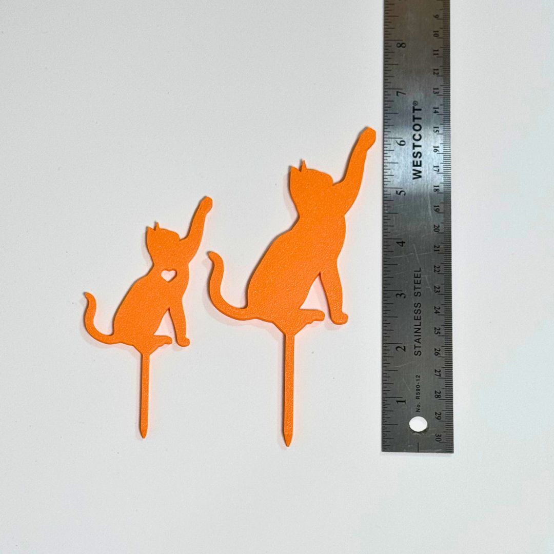 Cat plant stakes shown next to a ruler in two size variations