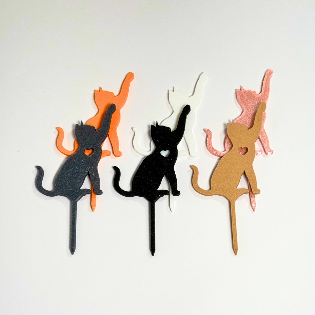 Cat plant stakes shown in six color variations in a reaching playful pose