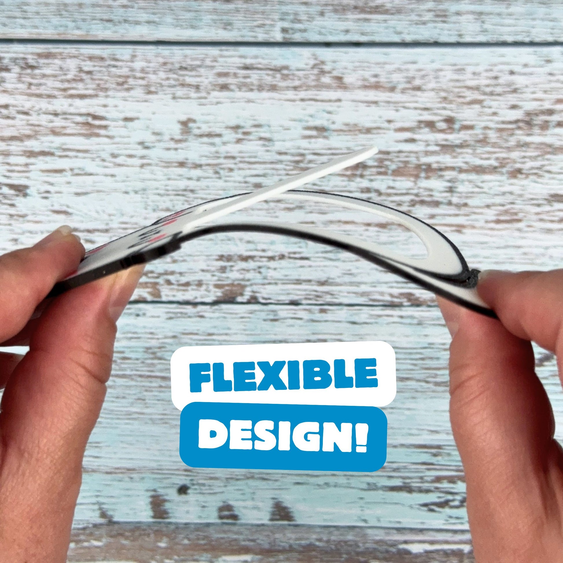 Bending cat bookmark showing off its flexible design