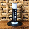 Black and white vinyl record lip balm stand holding a chapstick up