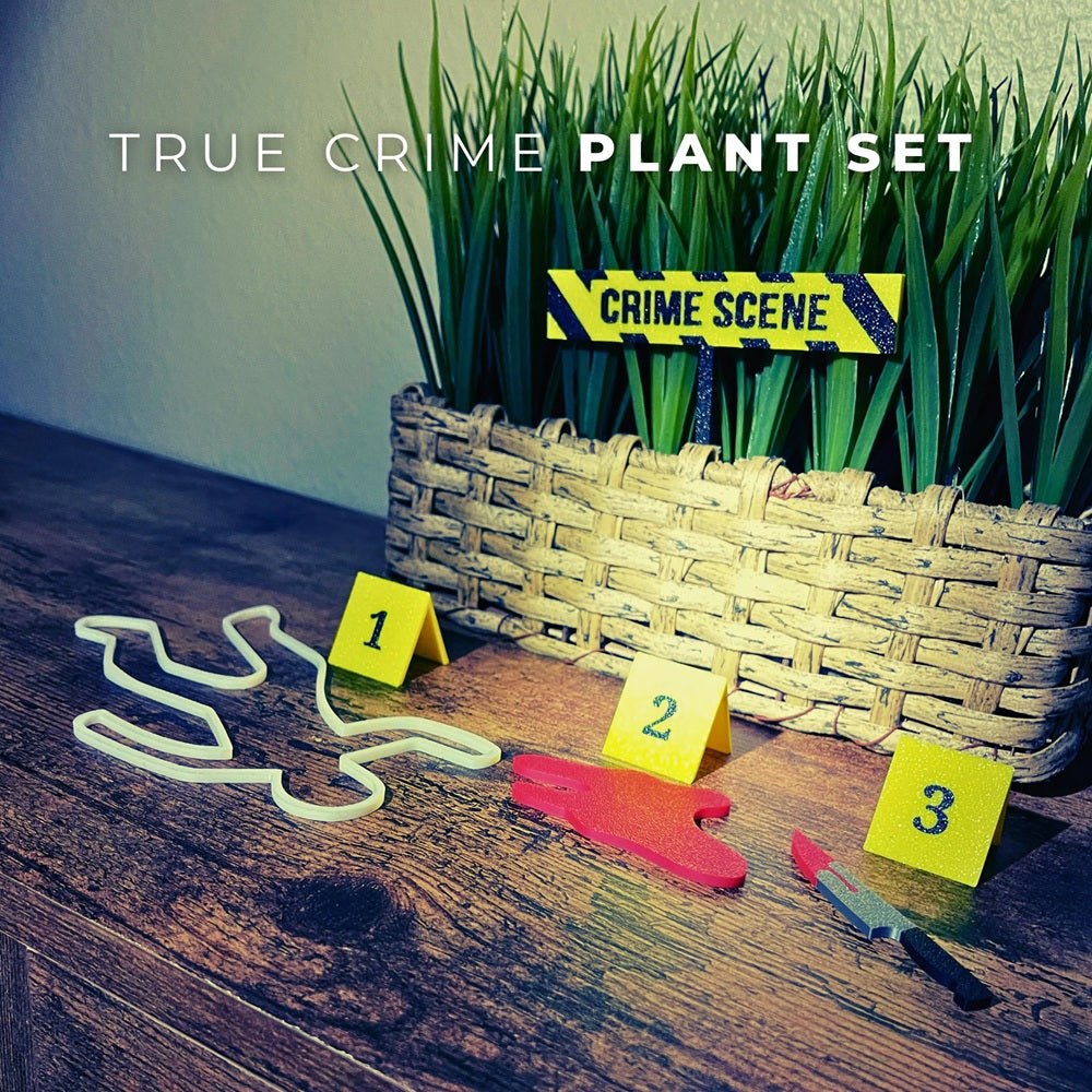 True crime scene plant decor set with a crime scene plant stake, body outline, bloody knife, blood pile, and scene markers