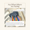 Cat-shaped rainbow bookmarks on an open book with customer feedback.