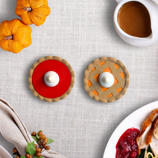 Pie fridge magnets in cherry red and pumpkin lattice on a holiday hosting table with mini pumpkins and gravy