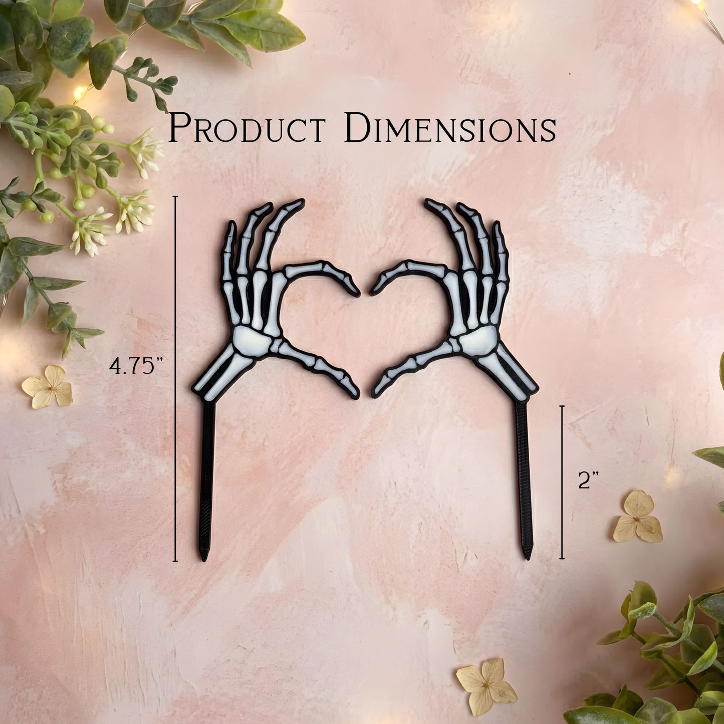 Skeleton hands forming a heart shape with product dimensions on a decorative background.