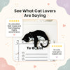 Magnet with a tuxedo cat design and customer reviews on a decorative background