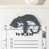 Gray tuxedo cat fridge magnet displayed on a refrigerator