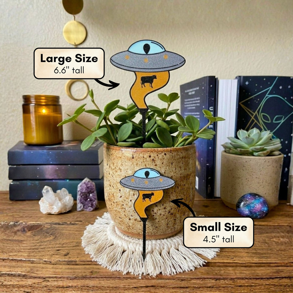Size guide for UFO plant stakes, large 6.6 inches tall and small 4.5 inches tall, shown in a potted plant