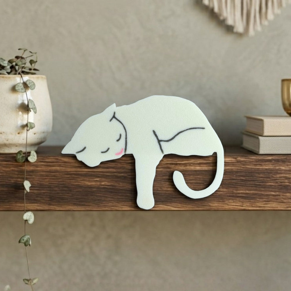 White cat shelf pet, sleeping kitty draped over a wood shelf edge with paw and tail hanging down