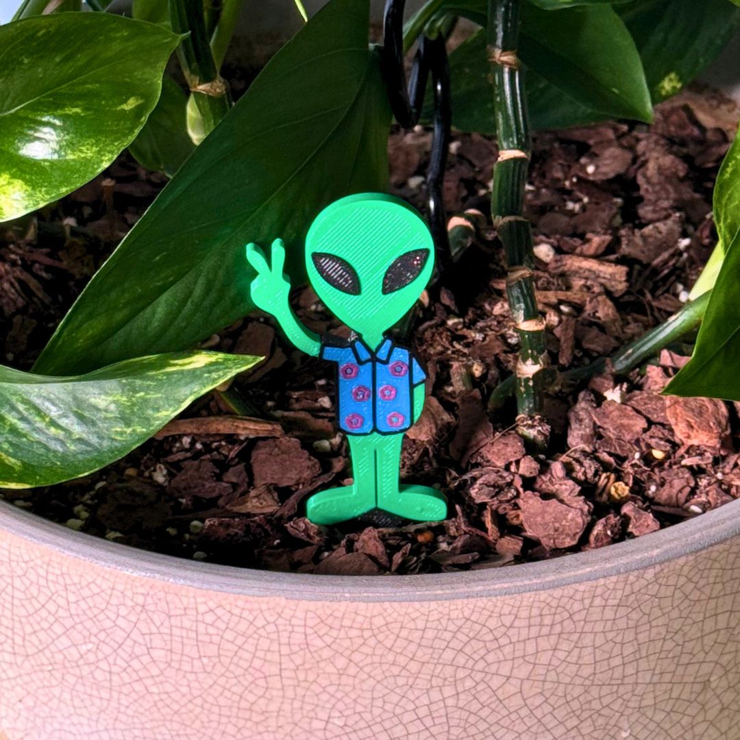 Fun alien plant stake in a houseplant