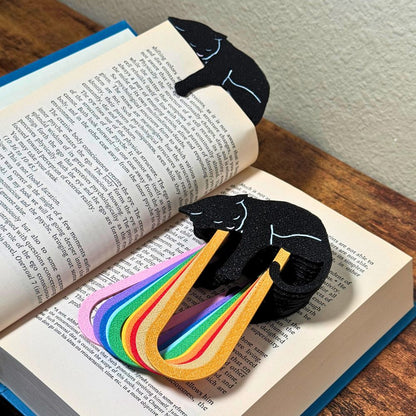 Close up of adorable black cat-themed bookmarks in eleven color variations