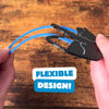 Black cat bookmark being bent, showing off its flexible design