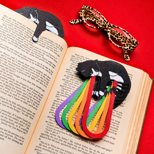 Tuxedo cat bookmarks shown in 5 out of the 11 different colors available including red, orange, yellow, green, and purple on a red background