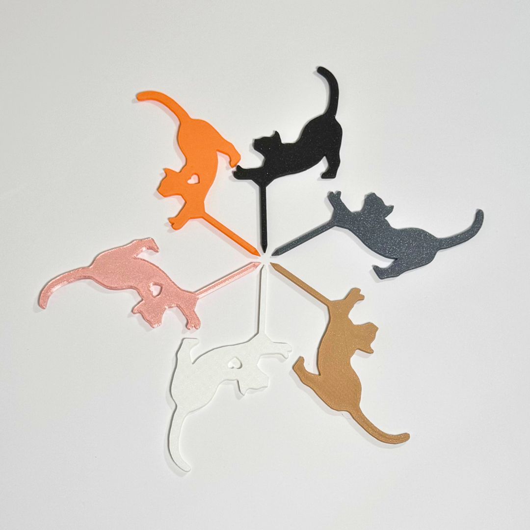 Cat plant stakes shown in six color variations in a stretching pose