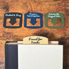 Four custom bookmarks shown in varying color combinations and phrases