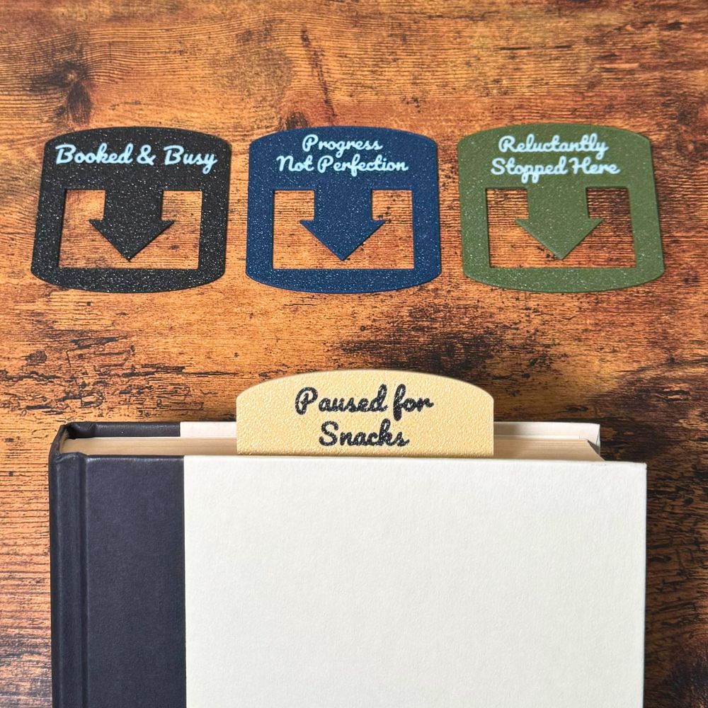 Four custom bookmarks shown in varying color combinations and phrases