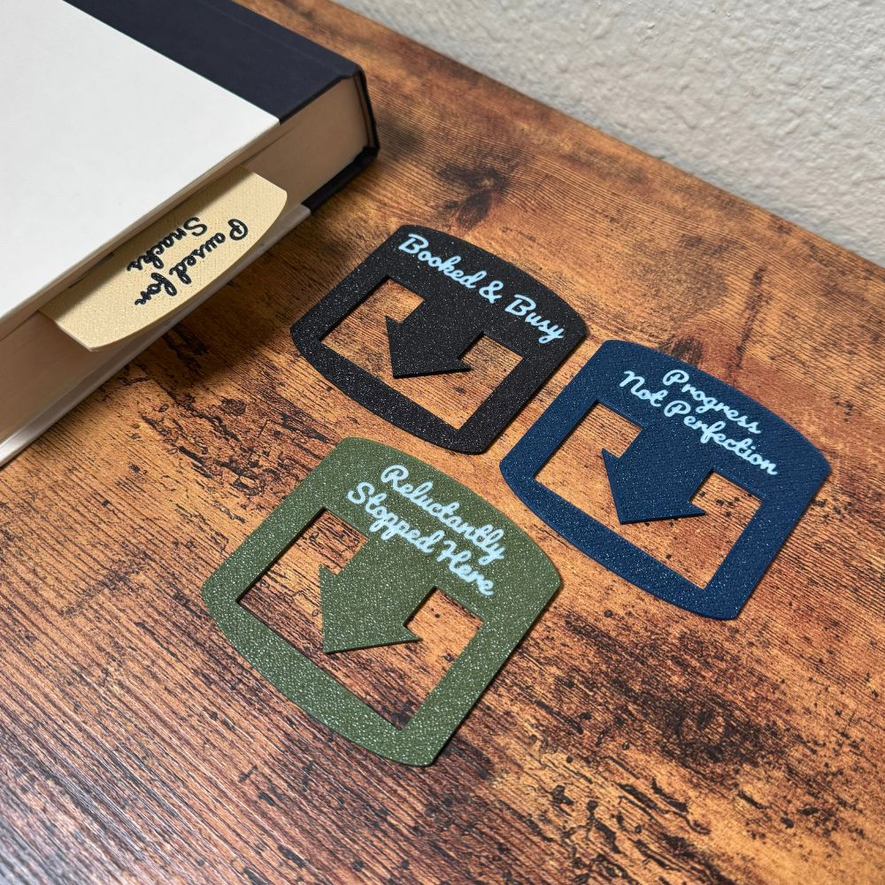 Four custom bookmarks shown in varying color combinations and phrases