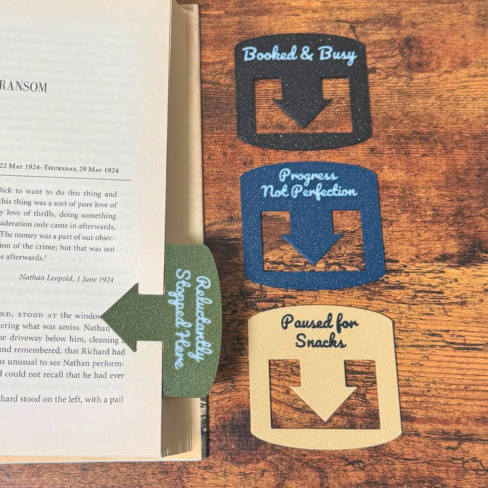 Four custom bookmarks shown in varying color combinations and phrases