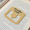 Tan bookmark spot keeper that reads Paused for Snacks in black font