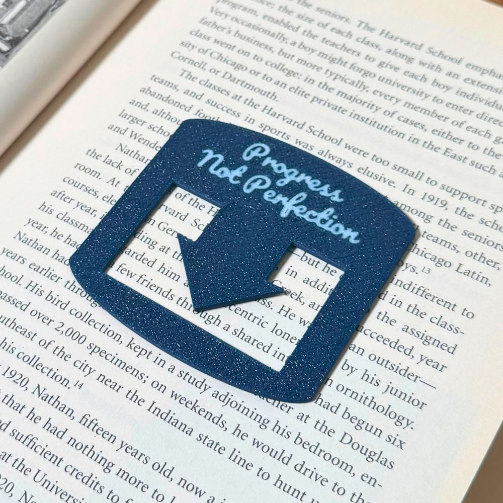 Navy bule bookmark spot keeper that reads Progress Not Perfection