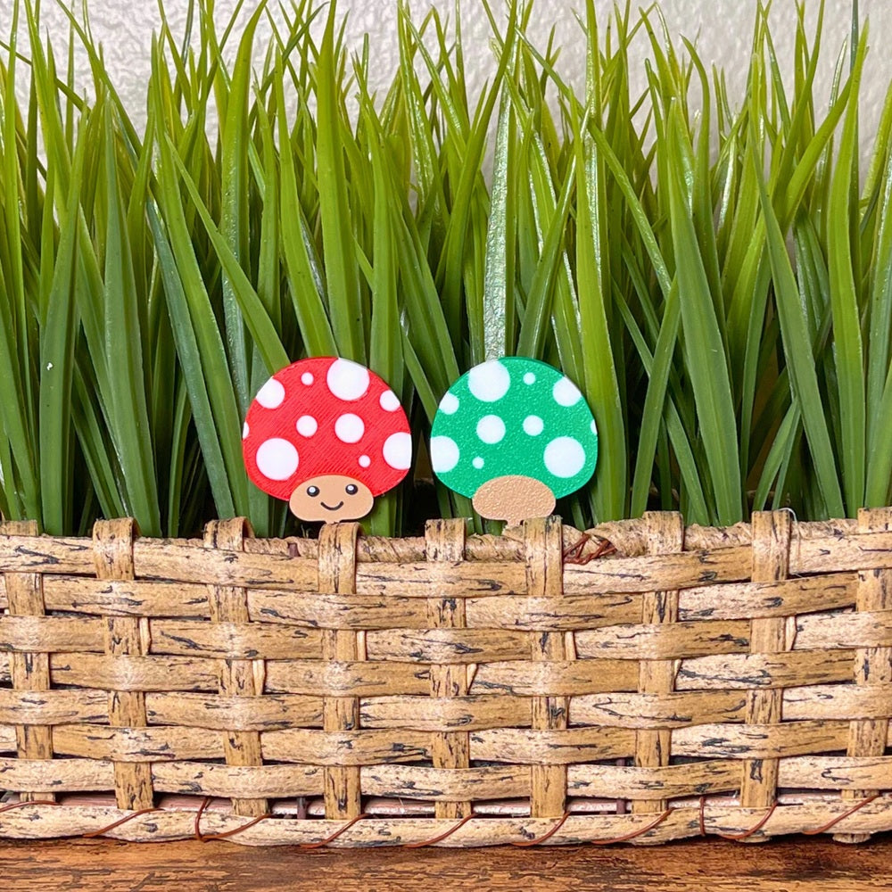 Cute mushroom plant stakes shown in red and green color variations showing both sides