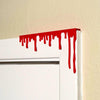 Red paint dripping door corner wall art hanging from the right side of the door