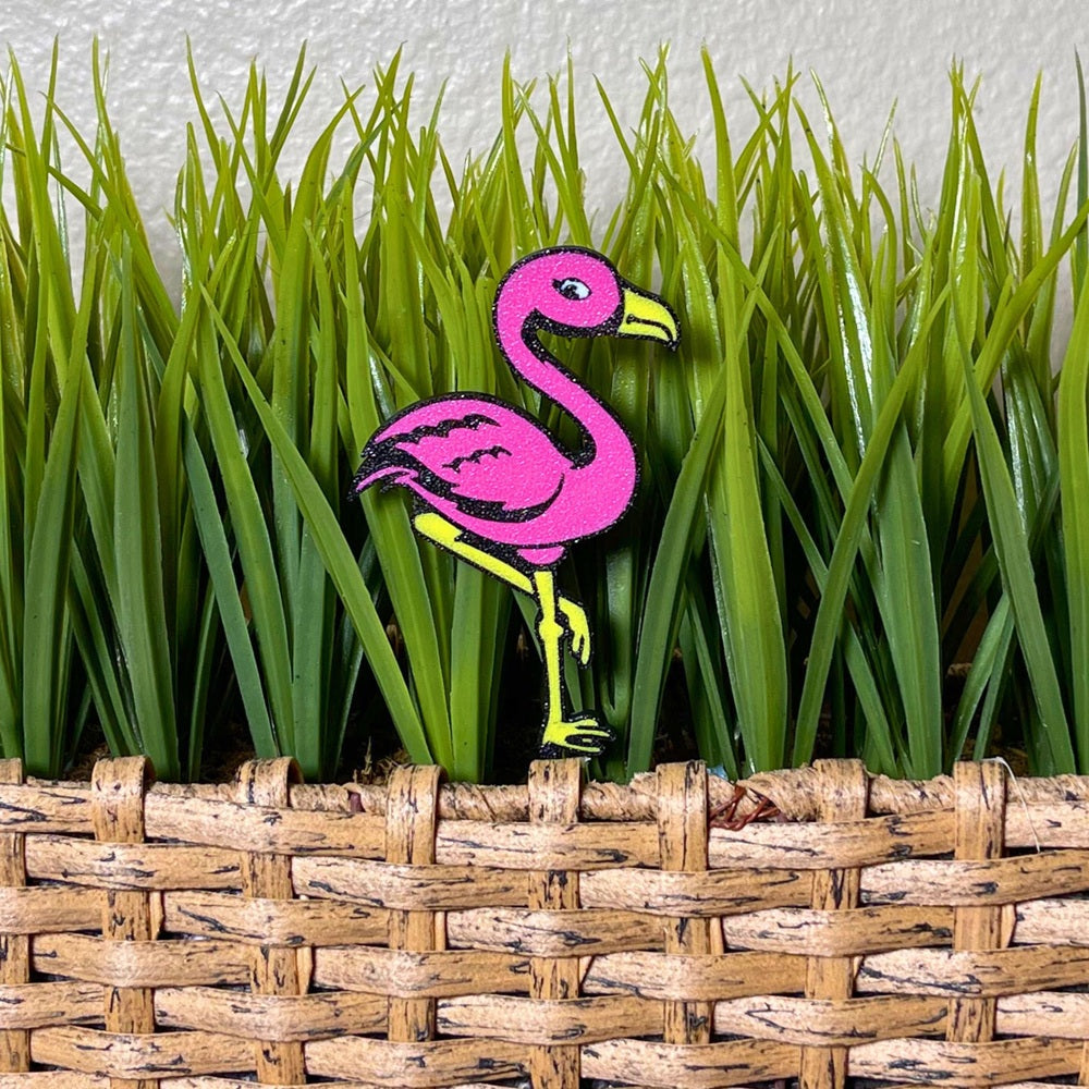 Fun flamingo plant stake shown in a magenta