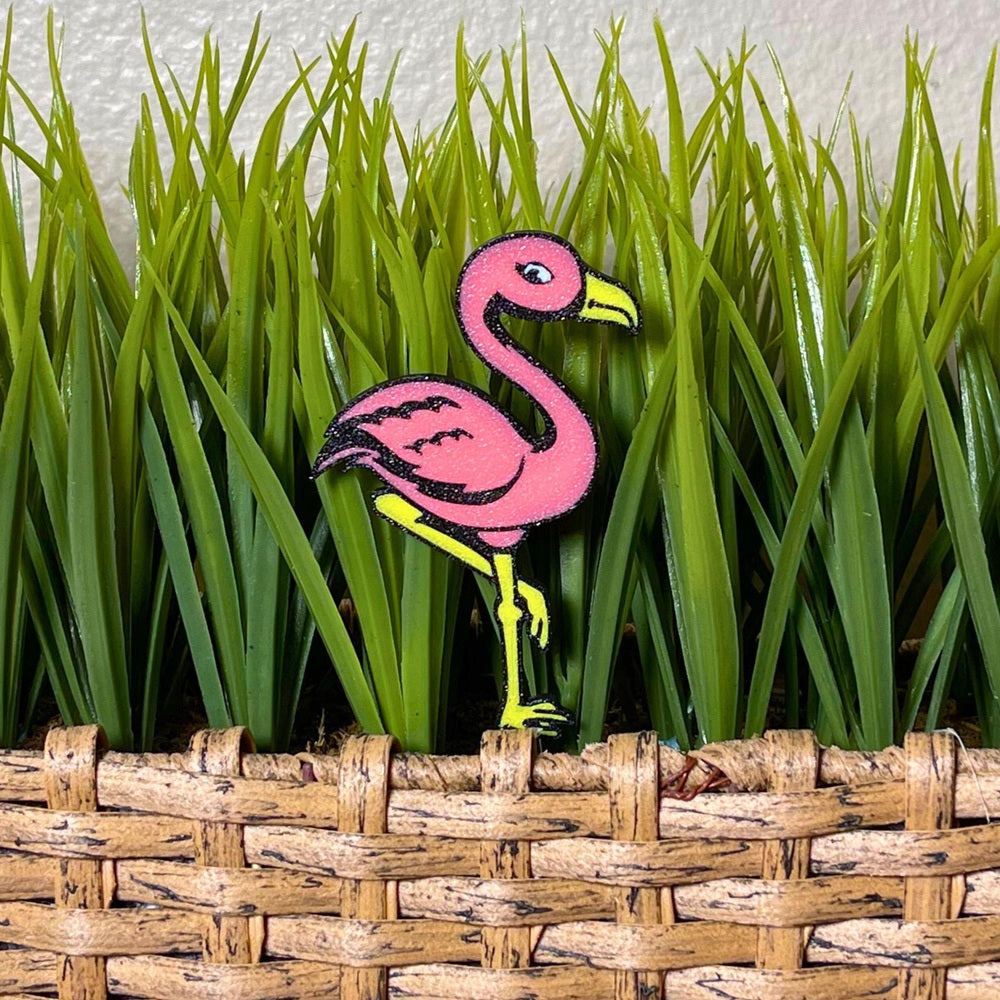 Fun flamingo plant stake shown in a pink