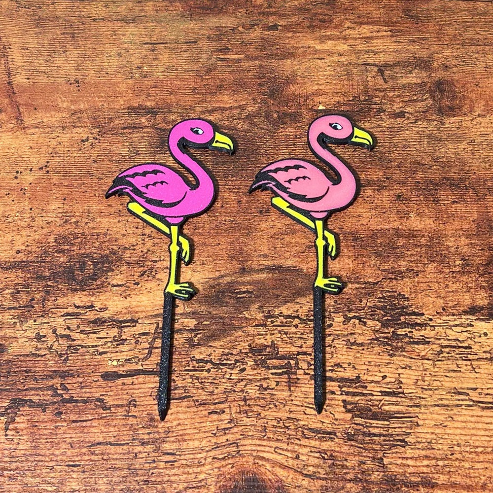 Fun flamingo plant stake shown in both color variations