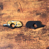 Adorable sleeping gold and white golden retriever dog book page holders shown on a wooden surface from the front and back