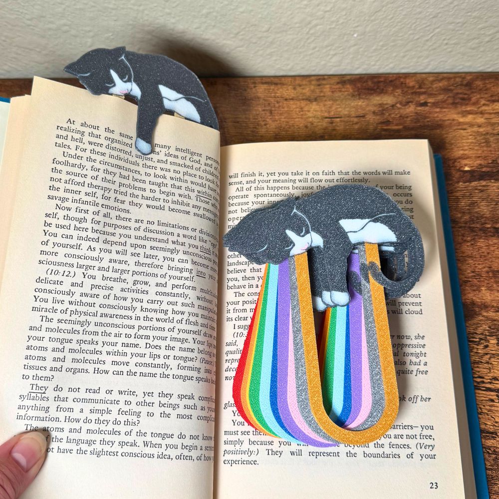Adorable gray tuxedo cat-themed bookmarks in eleven color variations