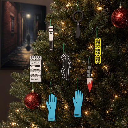 True crime ornaments hanging on a lit Christmas tree with red glitter baubles