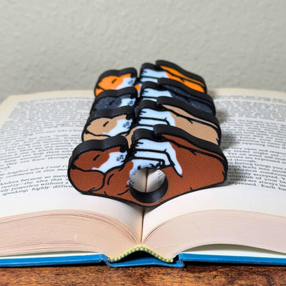 All 4 fur color variations for the dual color adorable sleeping puppy dog book page holders shown in a book from the front view