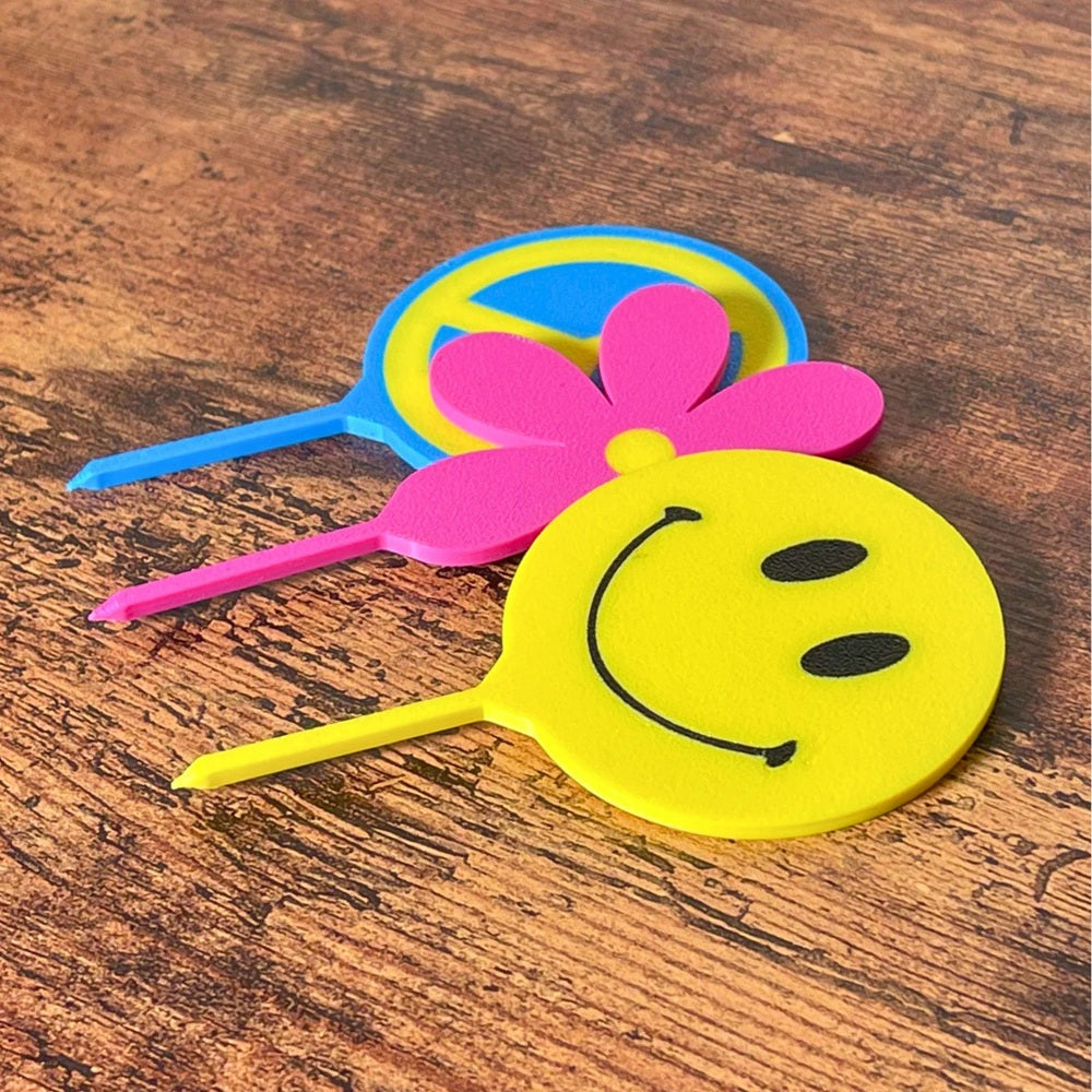 Retro plant stake set shown on a  wooden surface in 3 styles