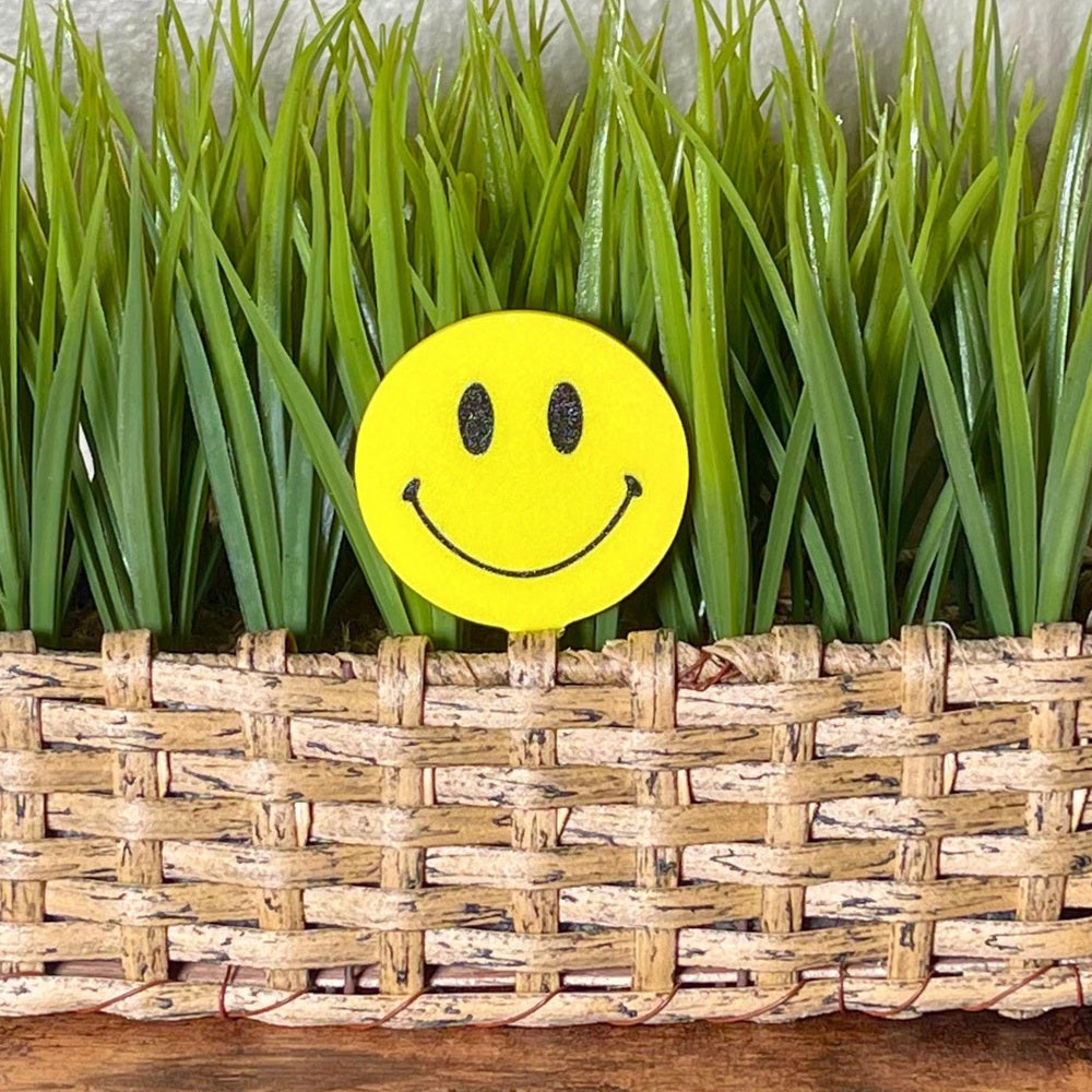 Retro plant stake in happy smiley face style