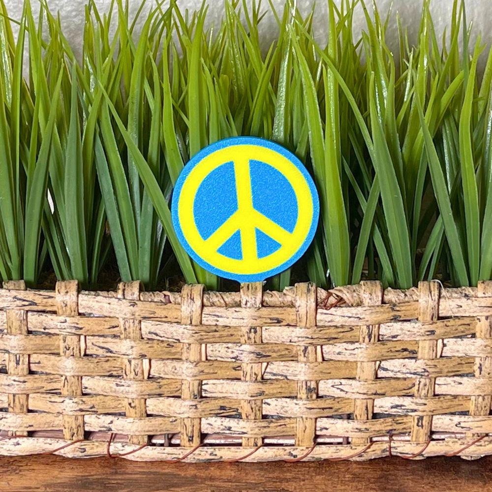 Retro plant stake in a fun peace sign style