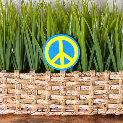 Retro plant stake in a fun peace sign style