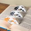 Adorable sleeping spotted cat book page holders shown in a book in orange gray and black