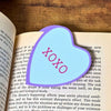 Sweet blue bookmark heart that reads XOXO inside a open book