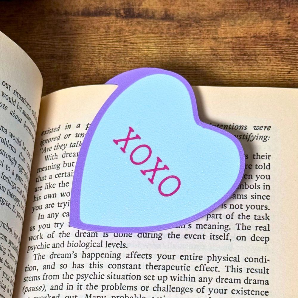 Sweet blue bookmark heart that reads XOXO inside a open book