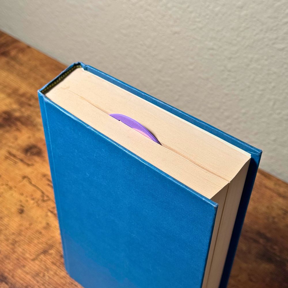 Sweet bookmark heart inside a closed book