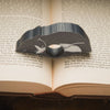 Close up of the gray tuxedo cat page holder